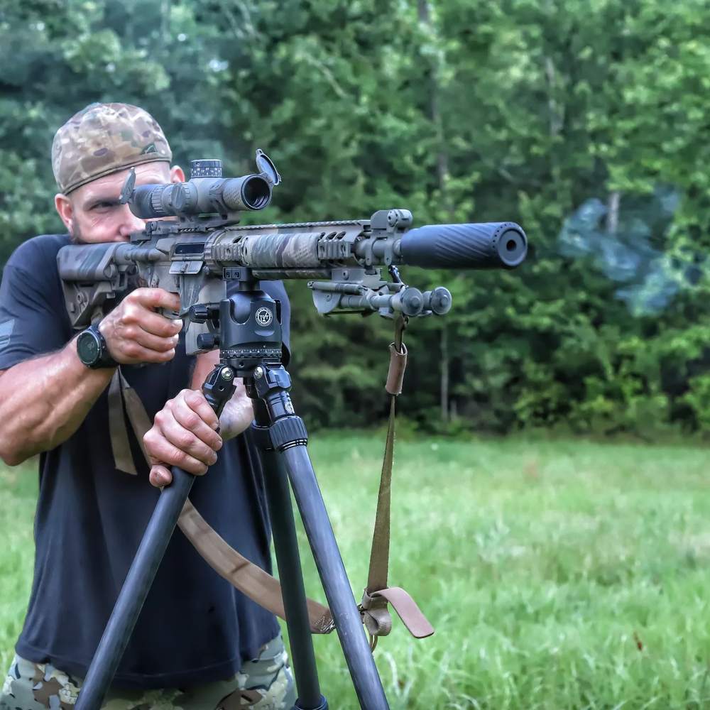 TBAC suppressor on tripod-mounted rifle, mid string